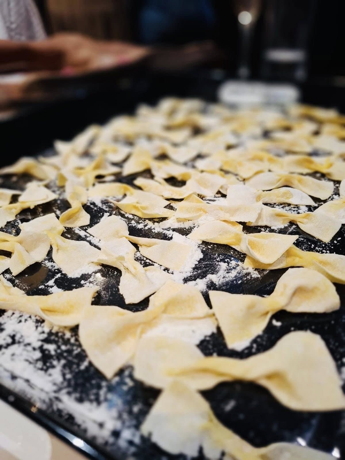 Freshly shaped farfalle laid out to dry