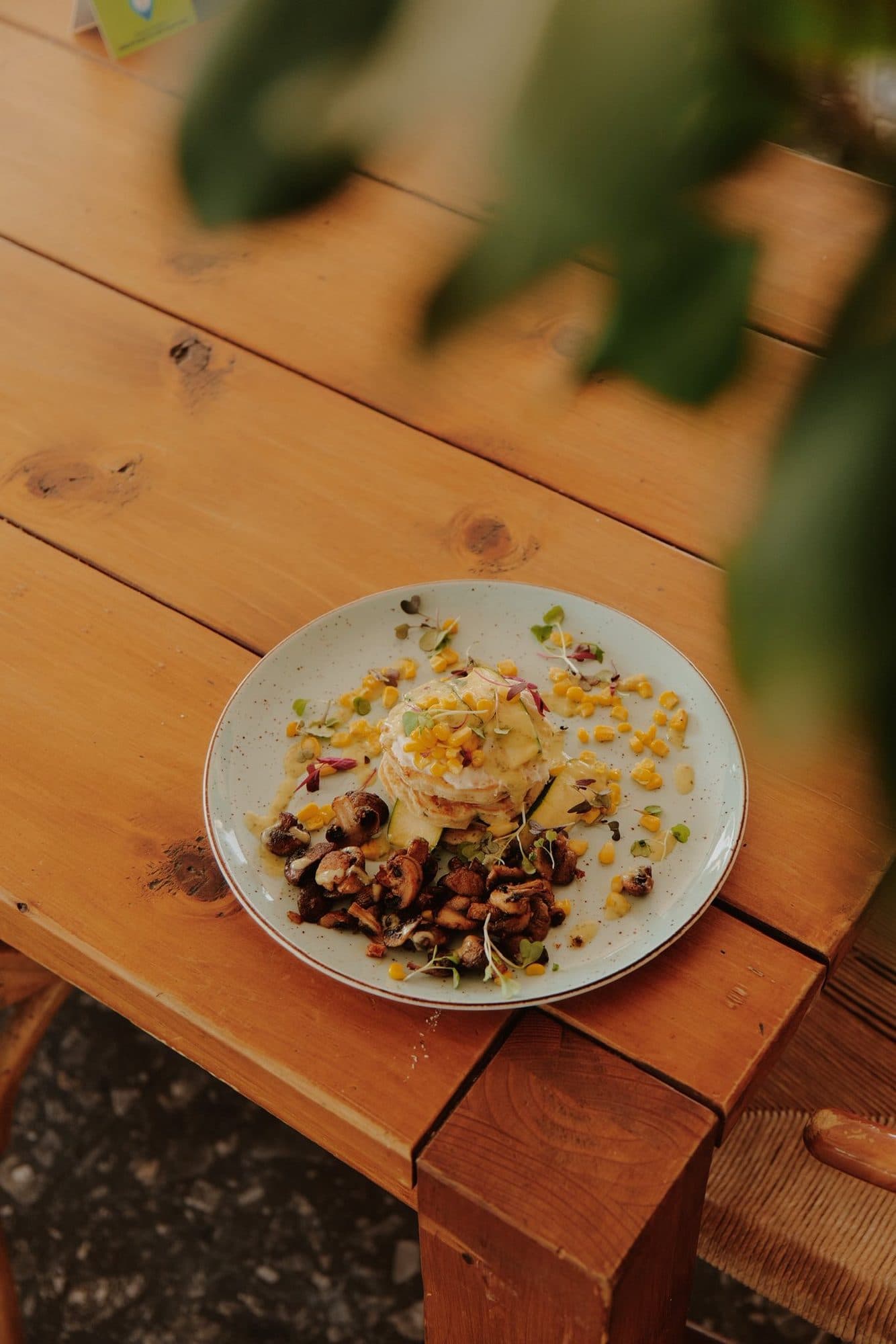 A small plate served on a wooden outdoor table