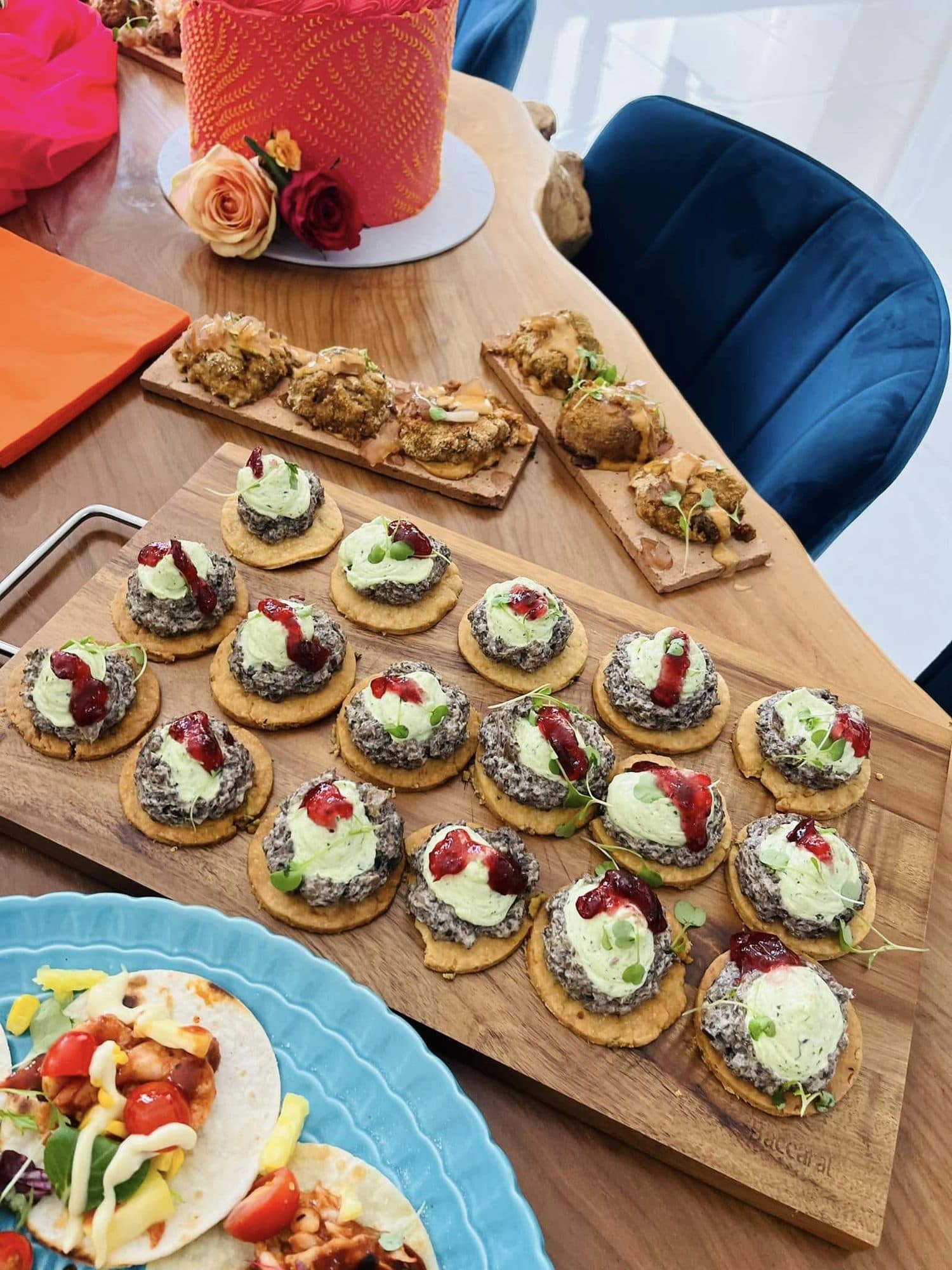 Wooden boards of canapés laid out on a celebration table