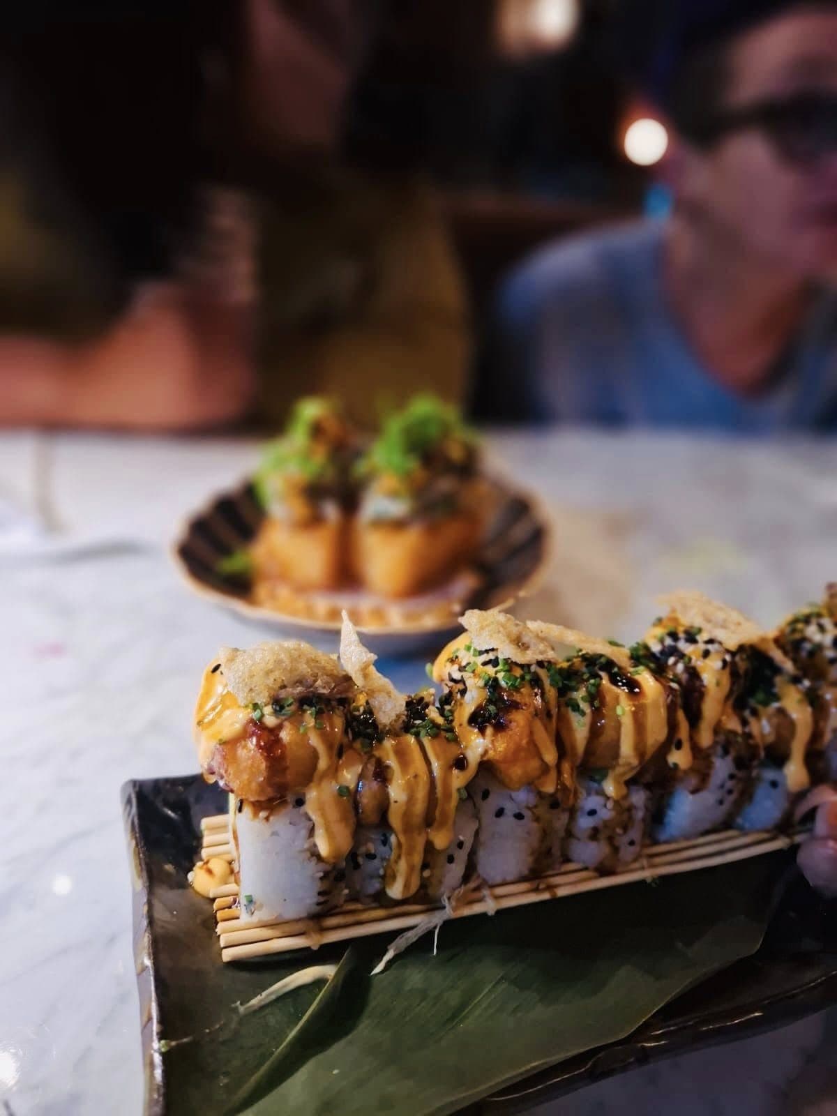 A tray of canapé skewers served to guests at an evening event