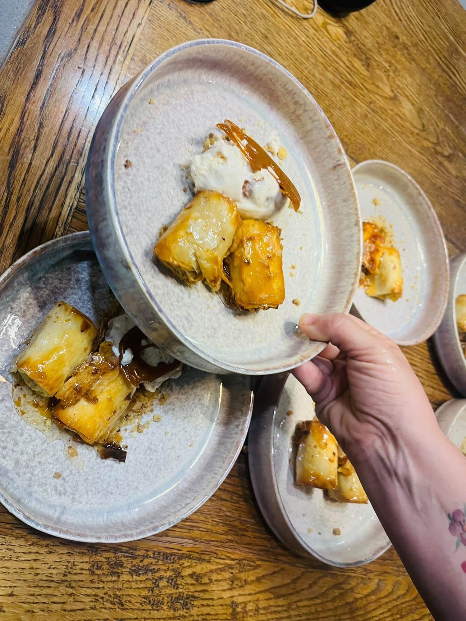 Plates of food being carried to the table at a private dinner