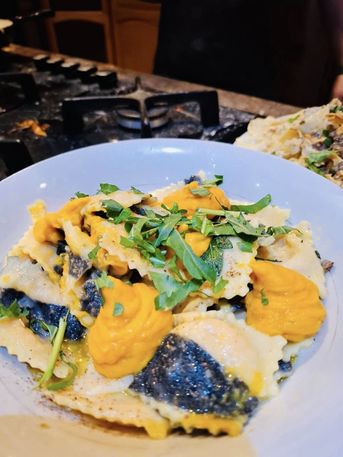 Handmade ravioli with butternut sauce and fresh herbs